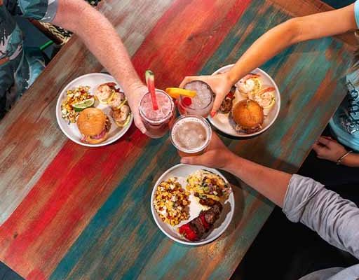 23 Restaurants Private Events Gallery | people eating food, playing various games and having fun